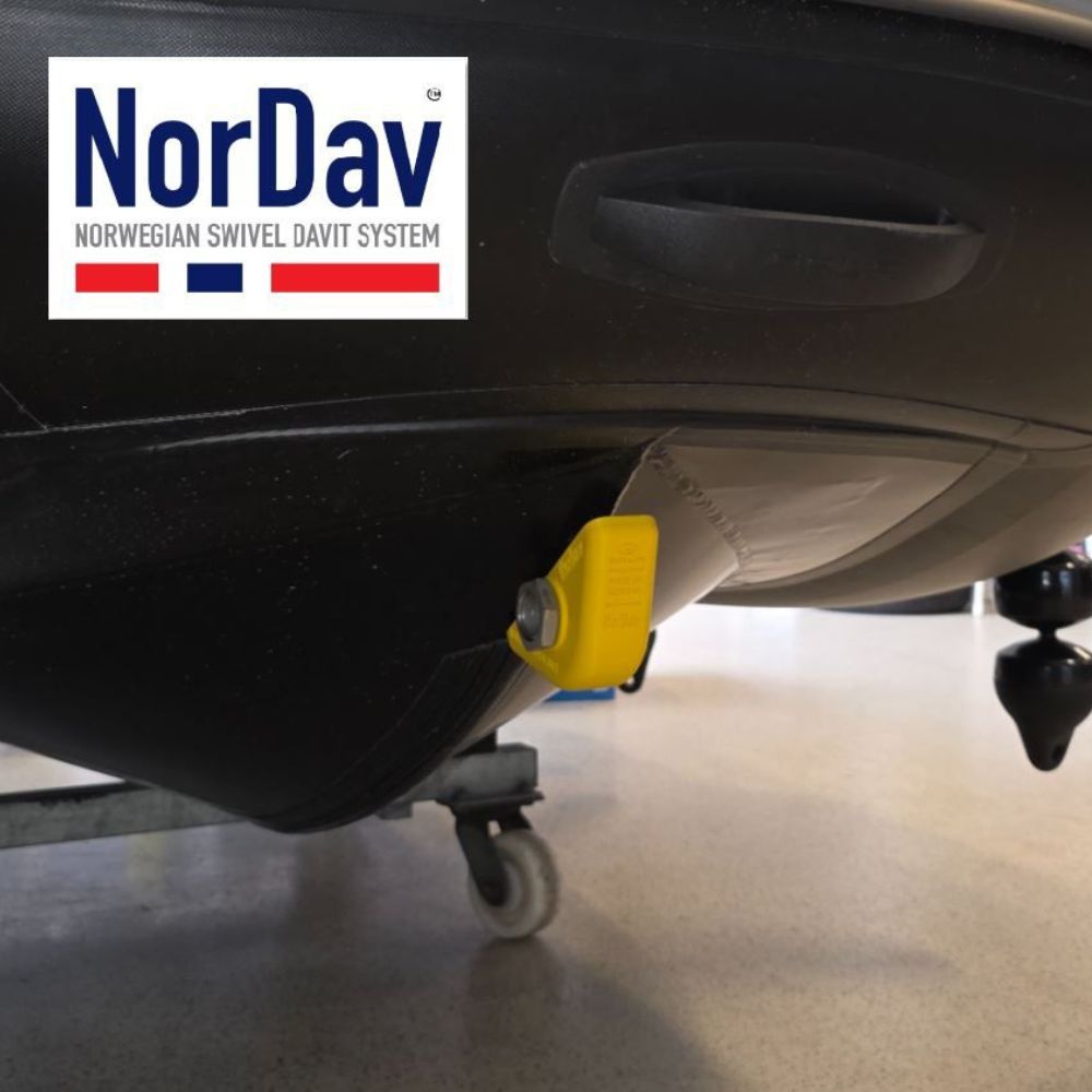 Gala RIB hull protector sliding cleanly onto the high-density polyethylene tracks of a marine swivel davit.