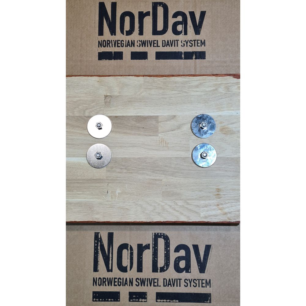 Close-up view of the NorDav quick-release flush mount base brackets anchored to a boat swim platform.