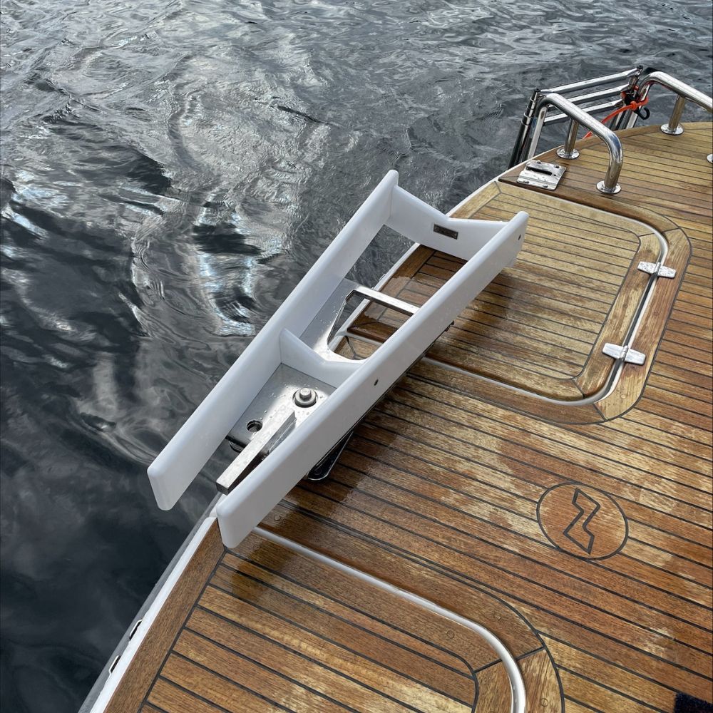 Side angle view highlighting the trip-free low-profile design of the removable davit base mount plates.