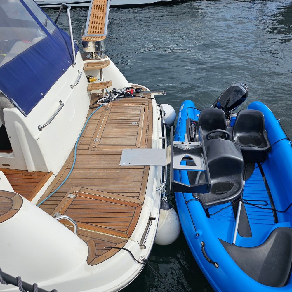 NorDav marine davit elevator 7 vertical extension bracket providing high-clearance lift past a stepped transom platform edge in Oceania.