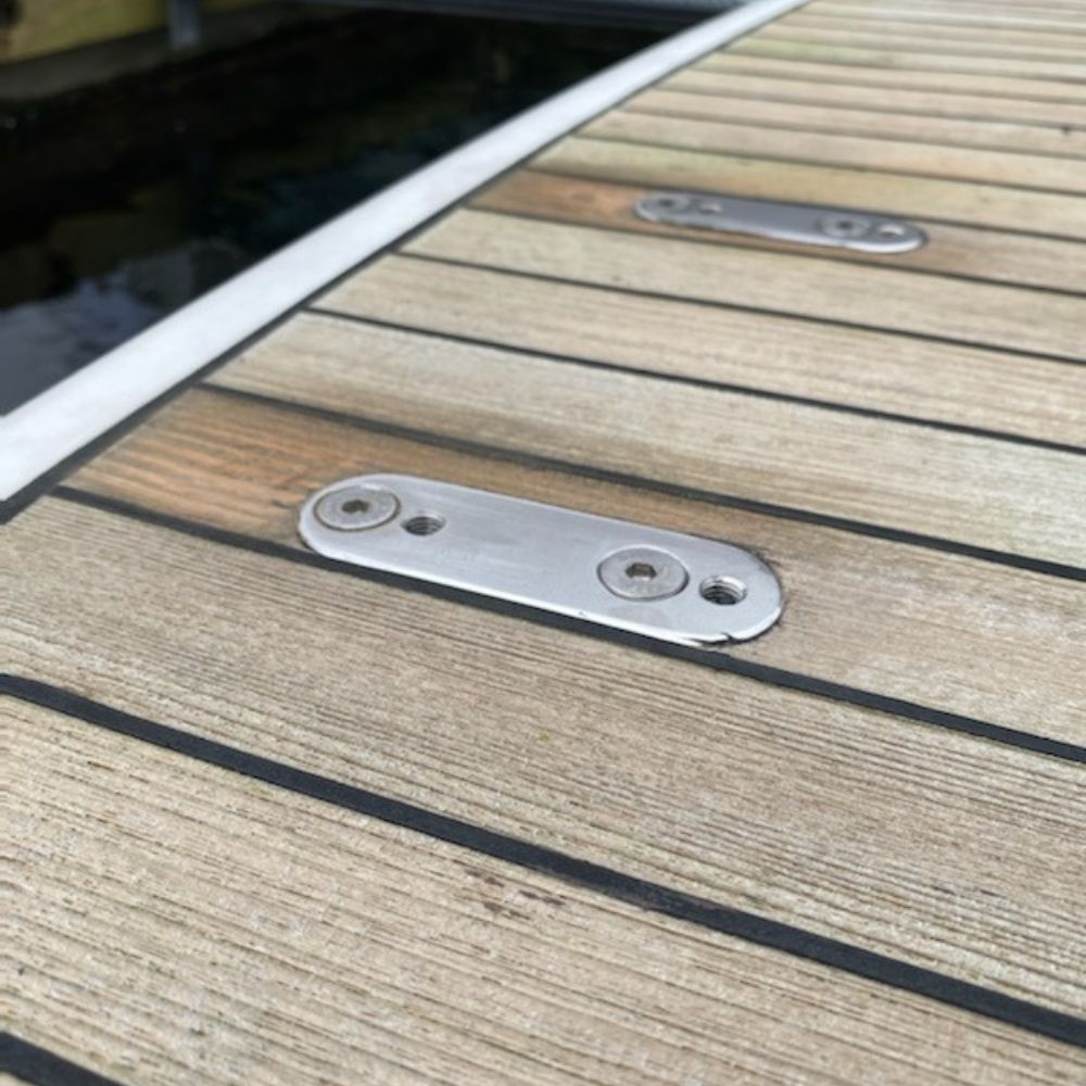 Heavy-lift quick-release flush deck mount base configured for a jet ski davit cradle on a motor yacht swim step.