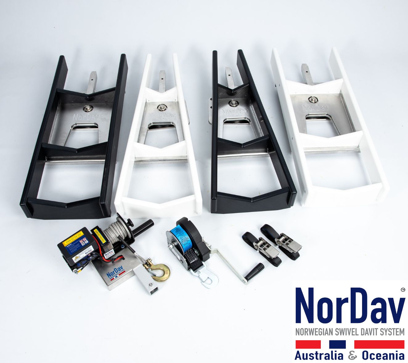 Rigid inflatable boat RIB tender resting securely inside a NorDav vertical swivel davit system installed on a luxury boat swim platform.
