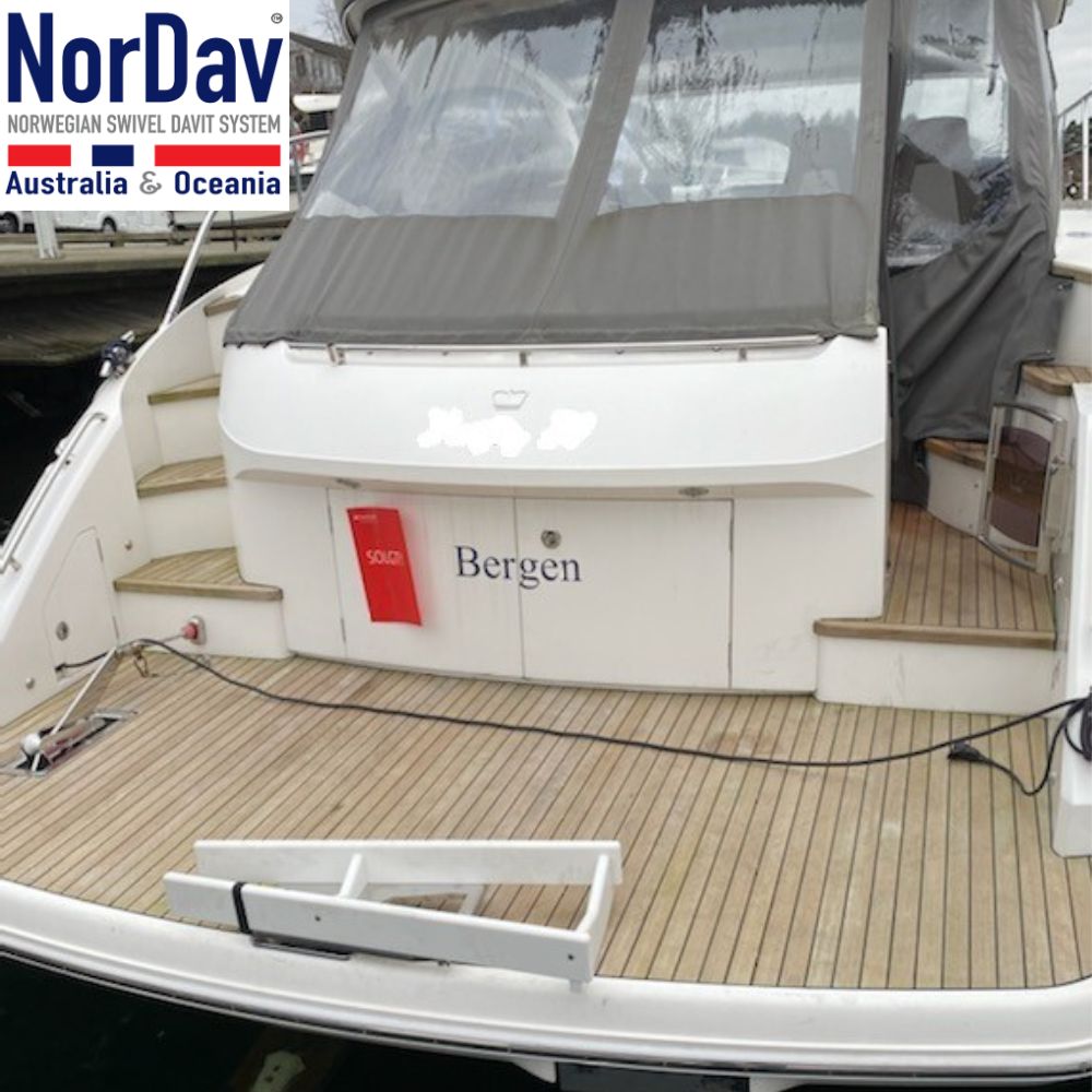 White NorDav V-Series vertical swivel davit system functioning as a 350kg boat tender and rigid inflatable boat (RIB) launch system on a yacht.